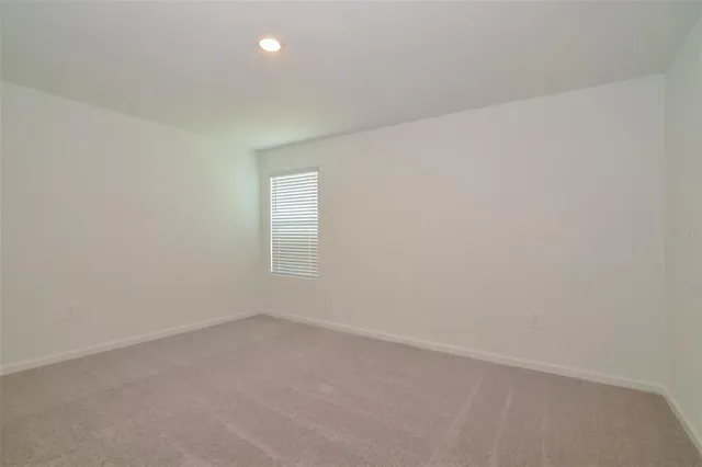 an empty room with a empty space and window