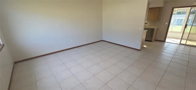 a view of an empty room and window