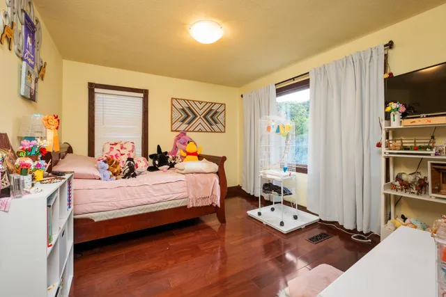 a bed room with furniture and a window