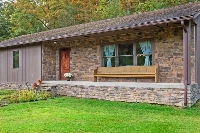 a view of a house with a small yard