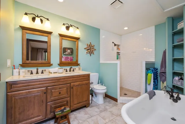 a bathroom with a toilet and a shower