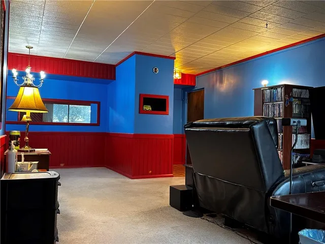 a room with furniture and flat screen tv