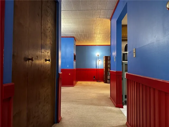 a view of lobby with a mirror