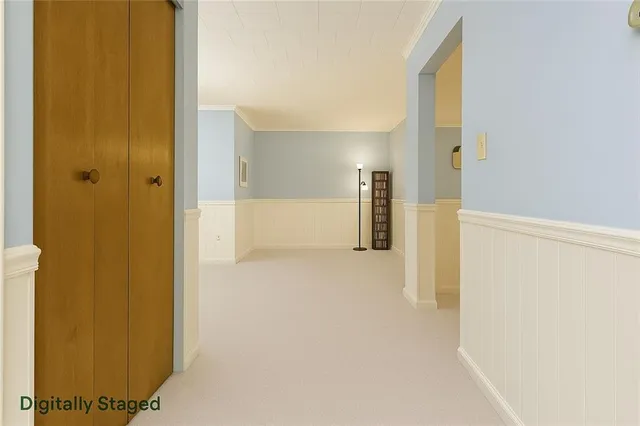 a view of a hallway with a refrigerator