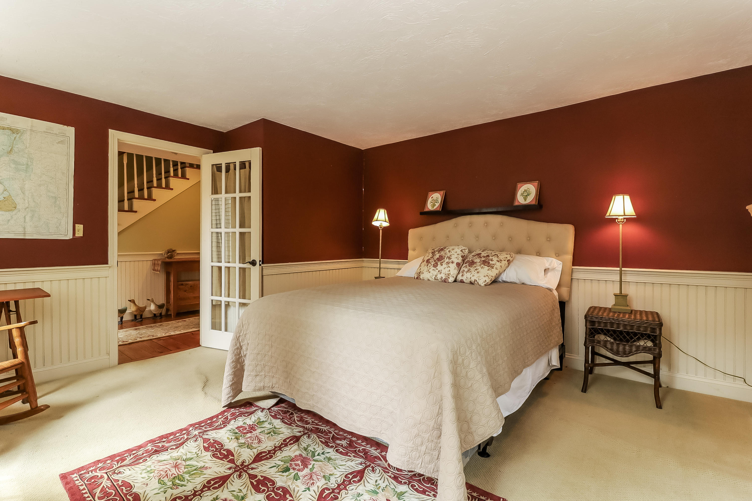 40 Captain Samadrus Road Cotuit, MA 02635 - Photo 8 of 22 a bedroom with a bed and a lamp with the dresser