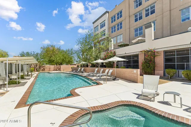 a view of a patio with a table and chairs