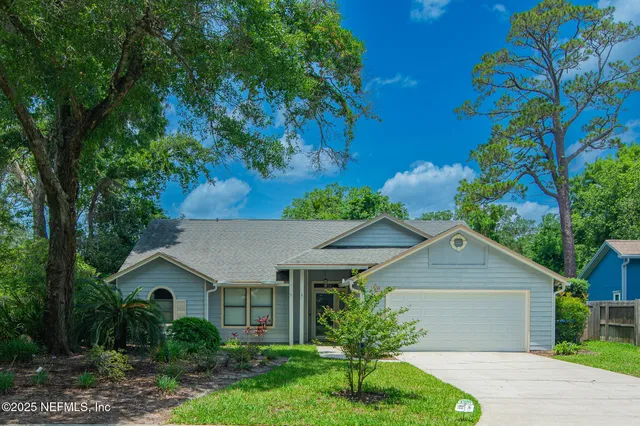 a house view with a garden space
