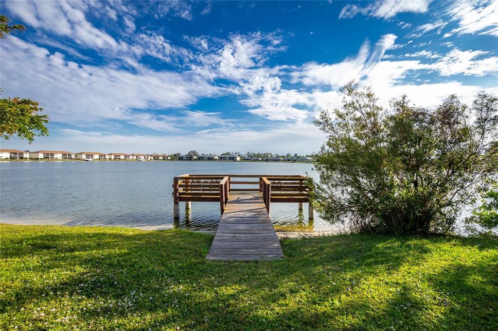 25225 Rampart Boulevard, Unit 1701 Punta Gorda, FL 33983 - Photo 13 of 21 a view of a lake with a garden
