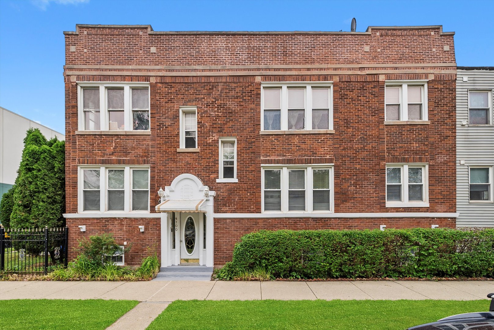 4100 West George Street Chicago, IL 60641 - Photo 1 of 49 a front view of a house with garden