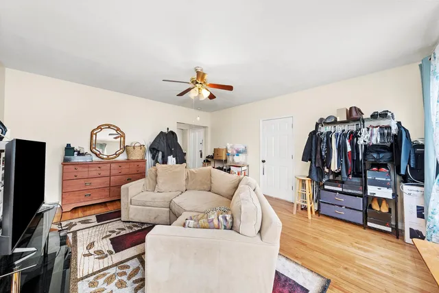 a living room with lots of furniture and a flat screen tv