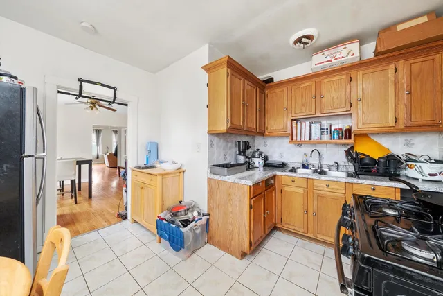 a kitchen with a sink appliances and cabinets