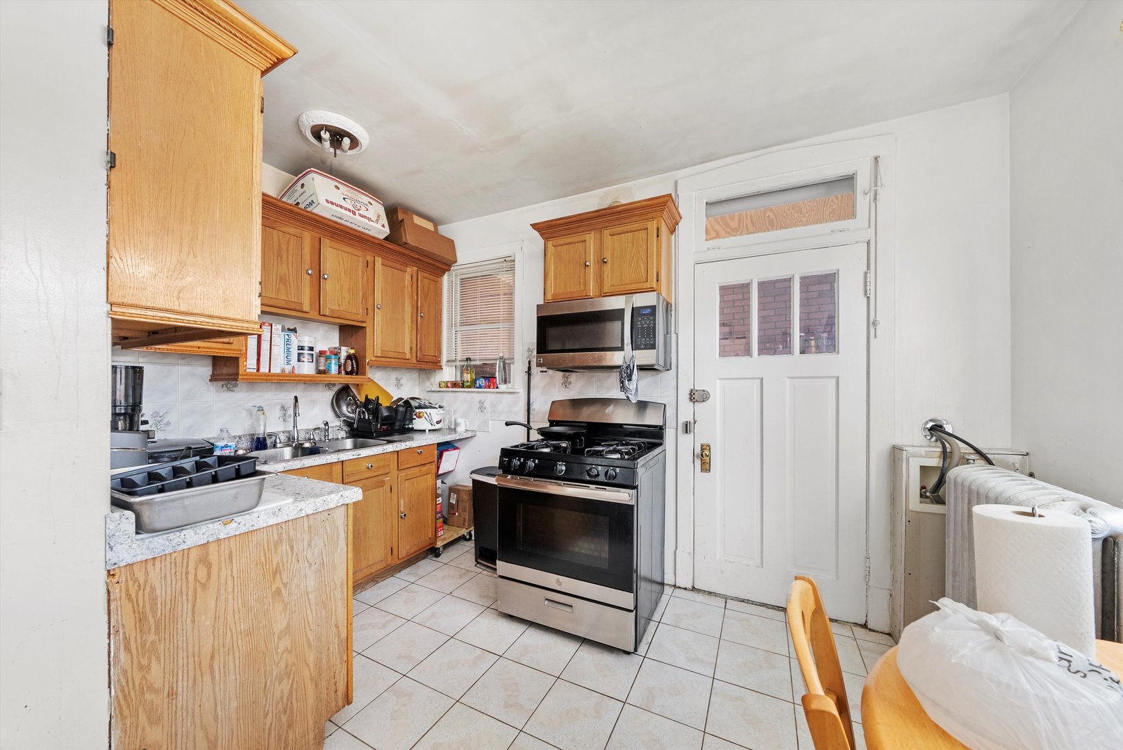 4100 West George Street Chicago, IL 60641 - Photo 16 of 49 a kitchen with stainless steel appliances a stove a sink and a refrigerator