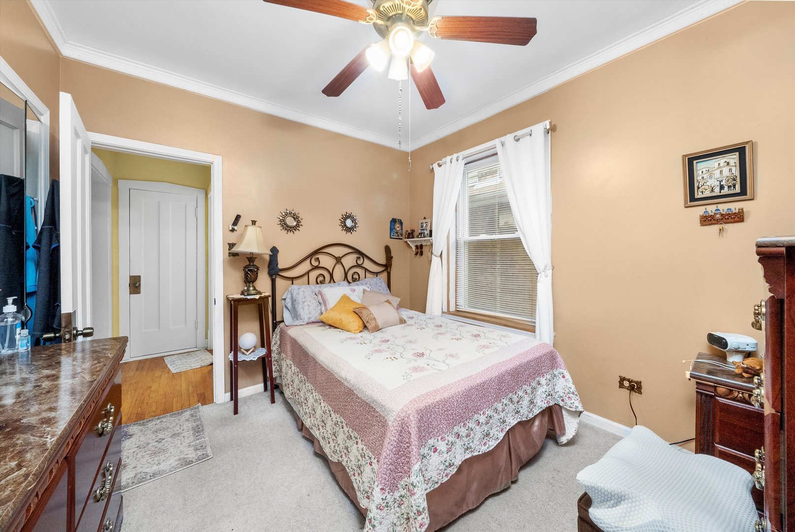 4100 West George Street Chicago, IL 60641 - Photo 22 of 49 a bedroom with a bed and a chandelier