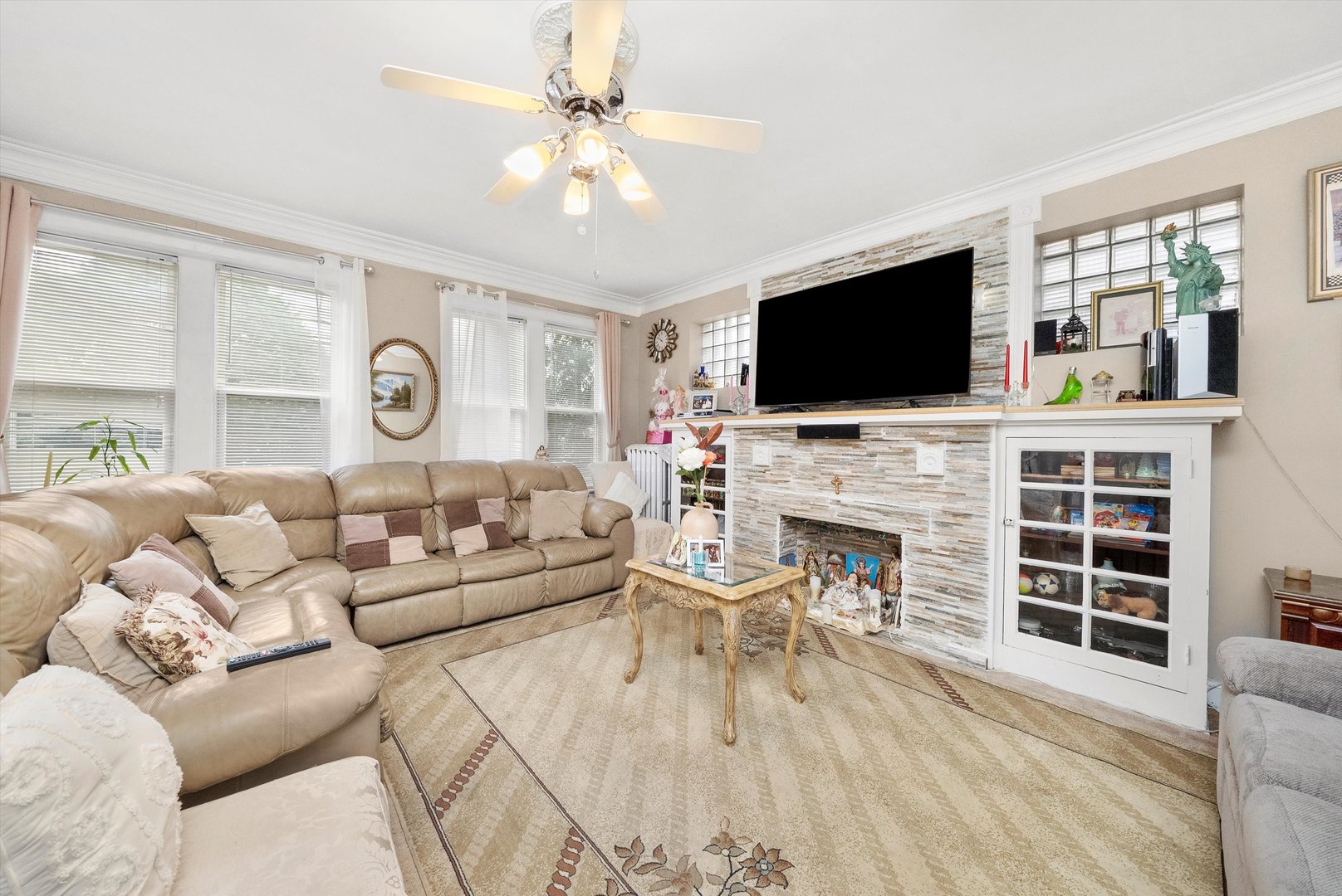 4100 West George Street Chicago, IL 60641 - Photo 25 of 49 a living room with furniture a fireplace and a flat screen tv