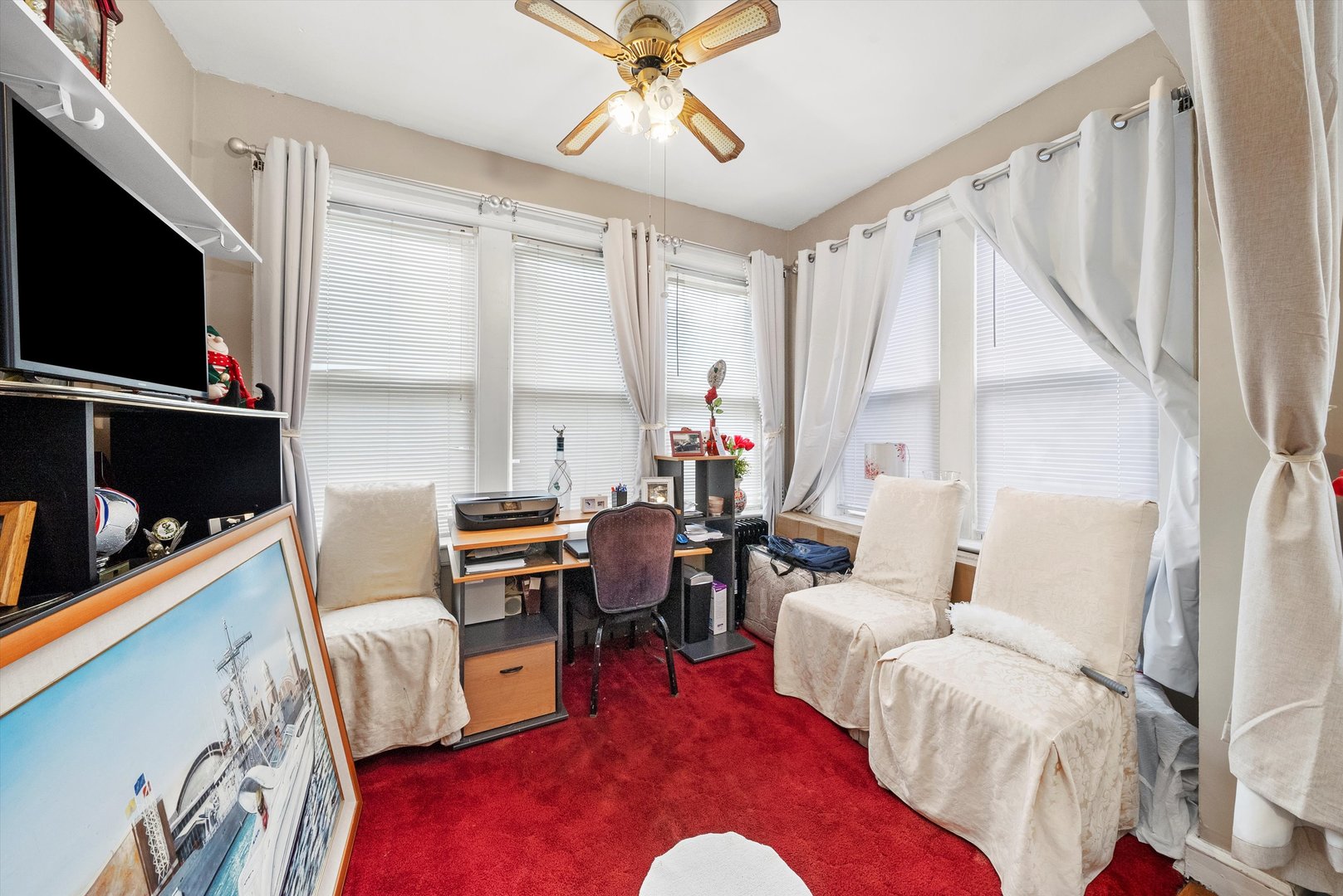 4100 West George Street Chicago, IL 60641 - Photo 28 of 49 a living room with furniture and a flat screen tv