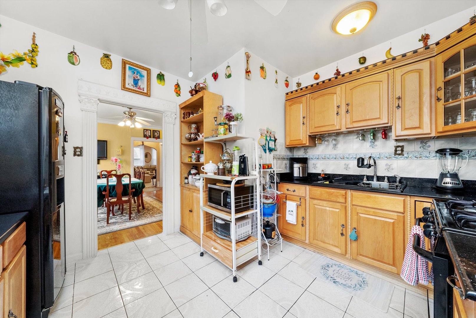 4100 West George Street Chicago, IL 60641 - Photo 29 of 49 a kitchen with stainless steel appliances granite countertop a stove and a refrigerator