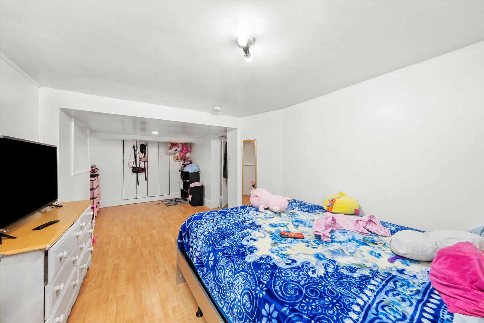 4100 West George Street Chicago, IL 60641 - Photo 35 of 49 a bedroom with a bed and flat screen tv