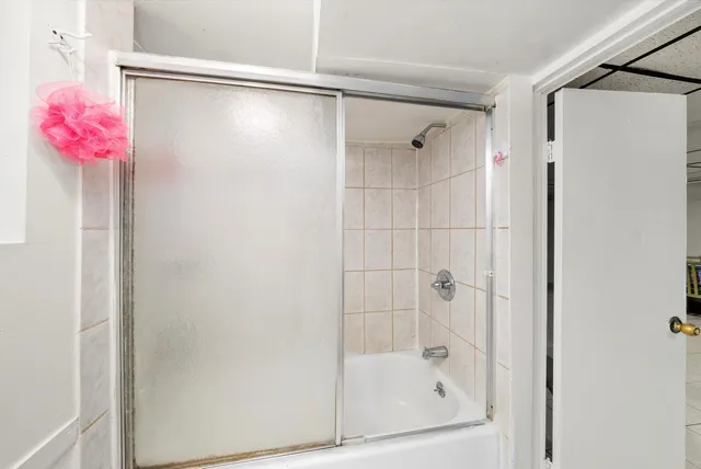 a utility room with cabinets washer and dryer