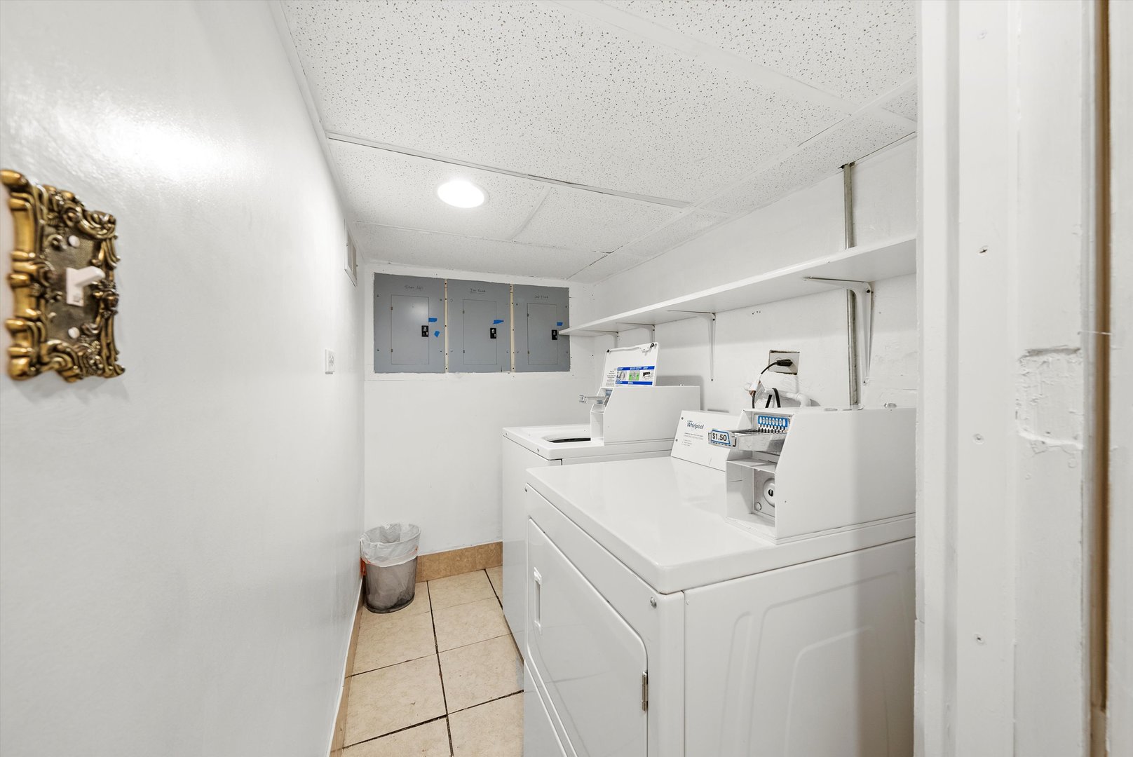 4100 West George Street Chicago, IL 60641 - Photo 40 of 49 a utility room with cabinets washer and dryer