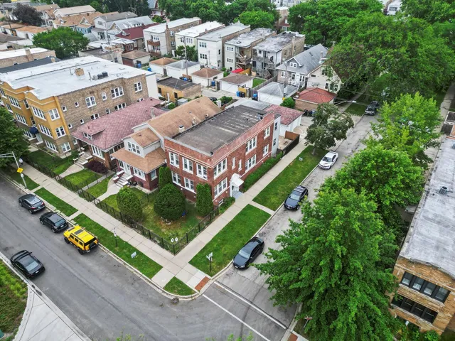 an aerial view of a house with a garden