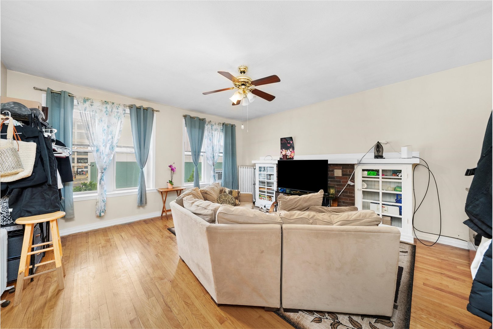 4100 West George Street Chicago, IL 60641 - Photo 9 of 49 a living room with furniture and a flat screen tv