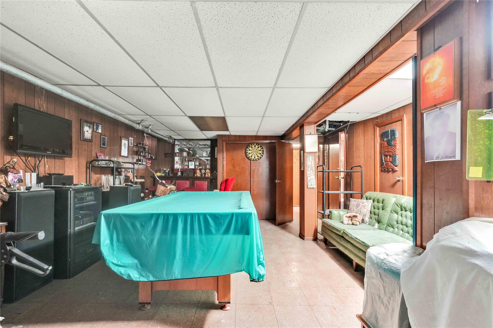 9908 35th Avenue Queens, NY 11368 - Photo 16 of 22 a room with lots of trees and furniture