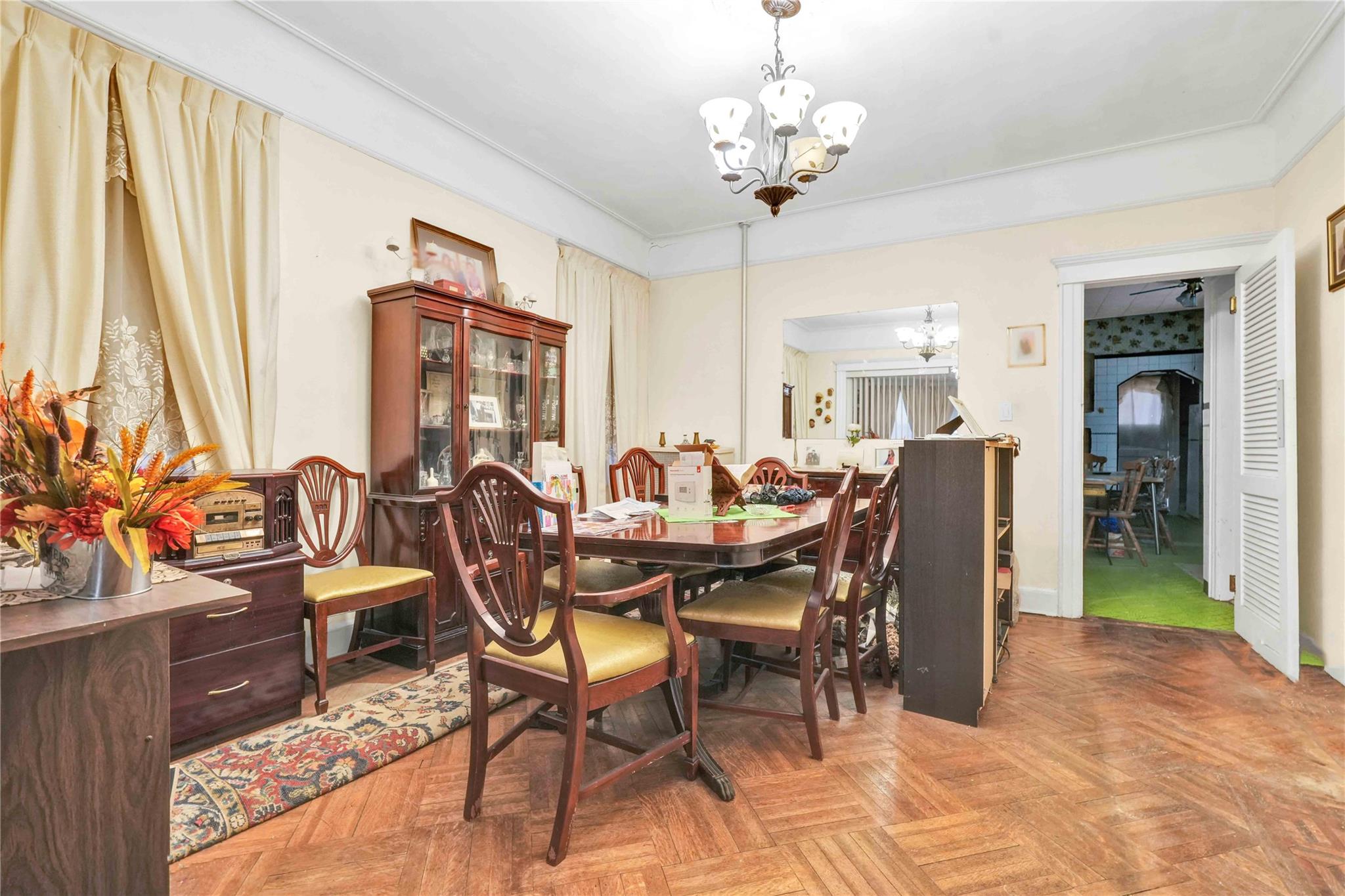 9908 35th Avenue Queens, NY 11368 - Photo 6 of 22 a view of a dining room with furniture window and outside view