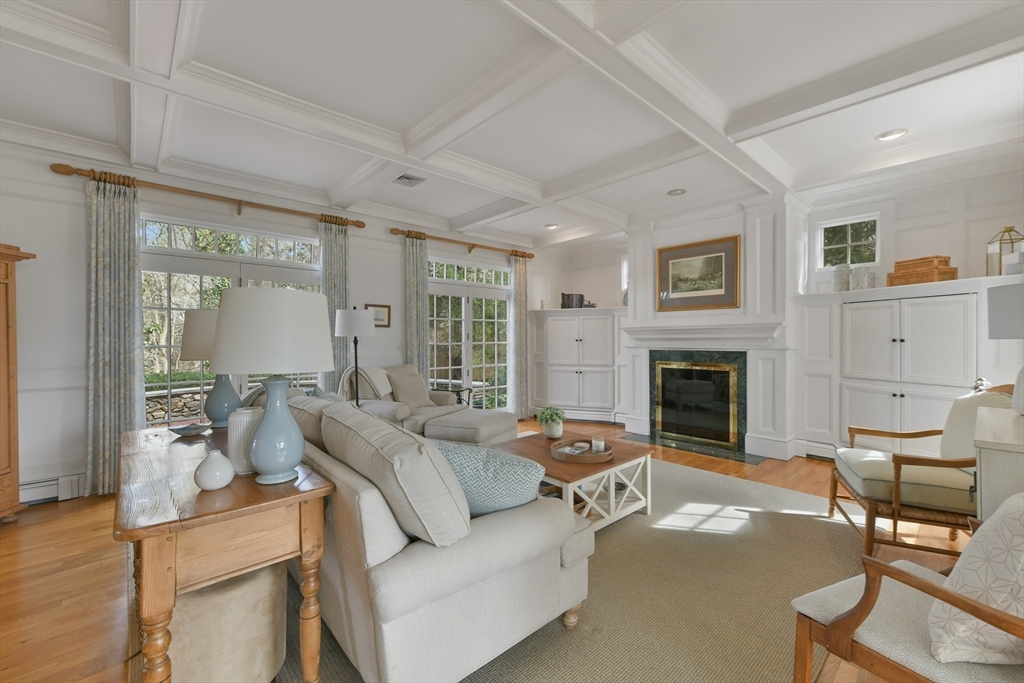 11 Olmsted Drive Hingham, MA 02043 - Photo 14 of 36 a living room with furniture a fireplace and a large window