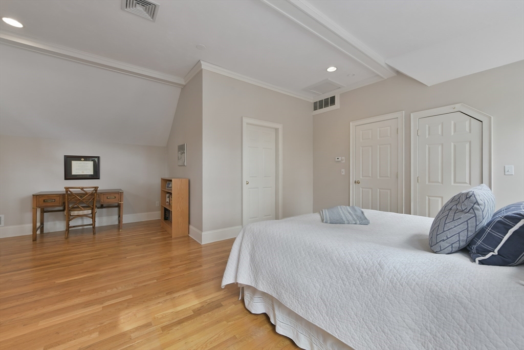 11 Olmsted Drive Hingham, MA 02043 - Photo 27 of 36 a bedroom with a bed and a table