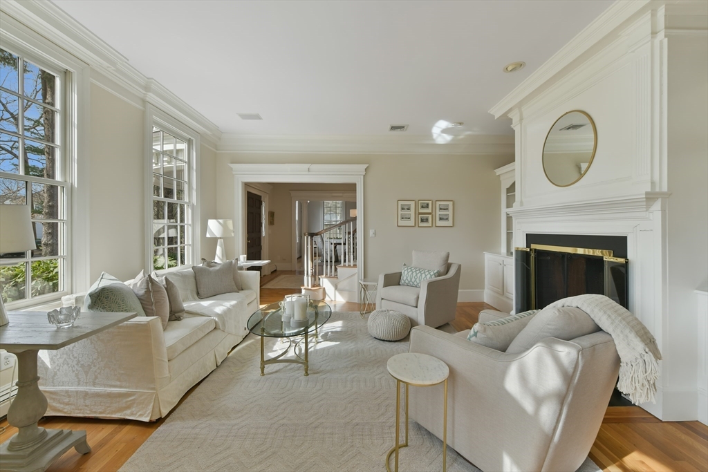 11 Olmsted Drive Hingham, MA 02043 - Photo 5 of 36 a living room with furniture a fireplace and a large window