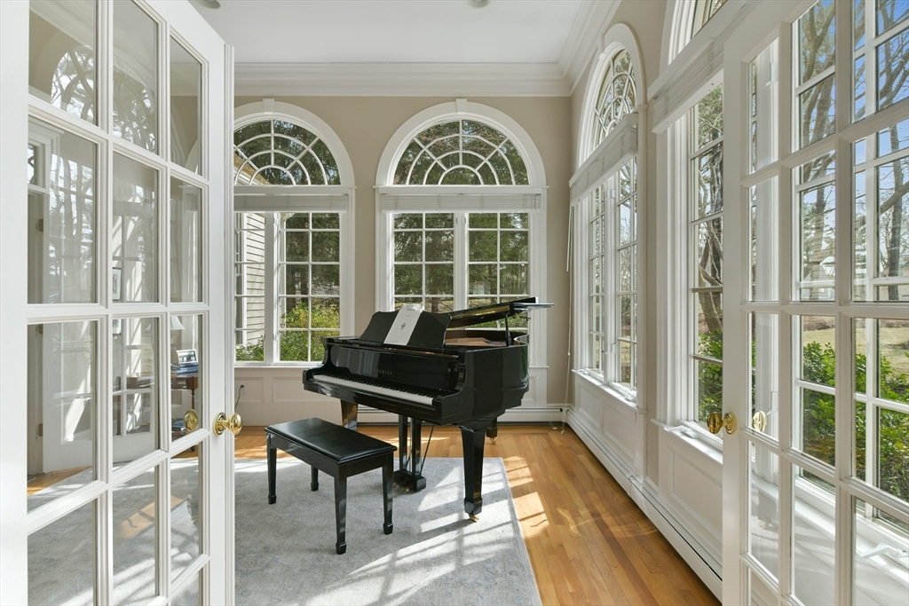 11 Olmsted Drive Hingham, MA 02043 - Photo 7 of 36 a view of a large room with wooden floor and windows