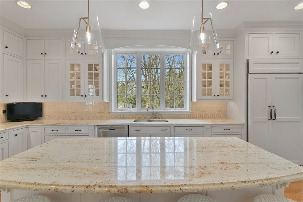 11 Olmsted Drive Hingham, MA 02043 - Photo 10 of 36 a view of a kitchen with granite countertop a sink stainless steel appliances and cabinets