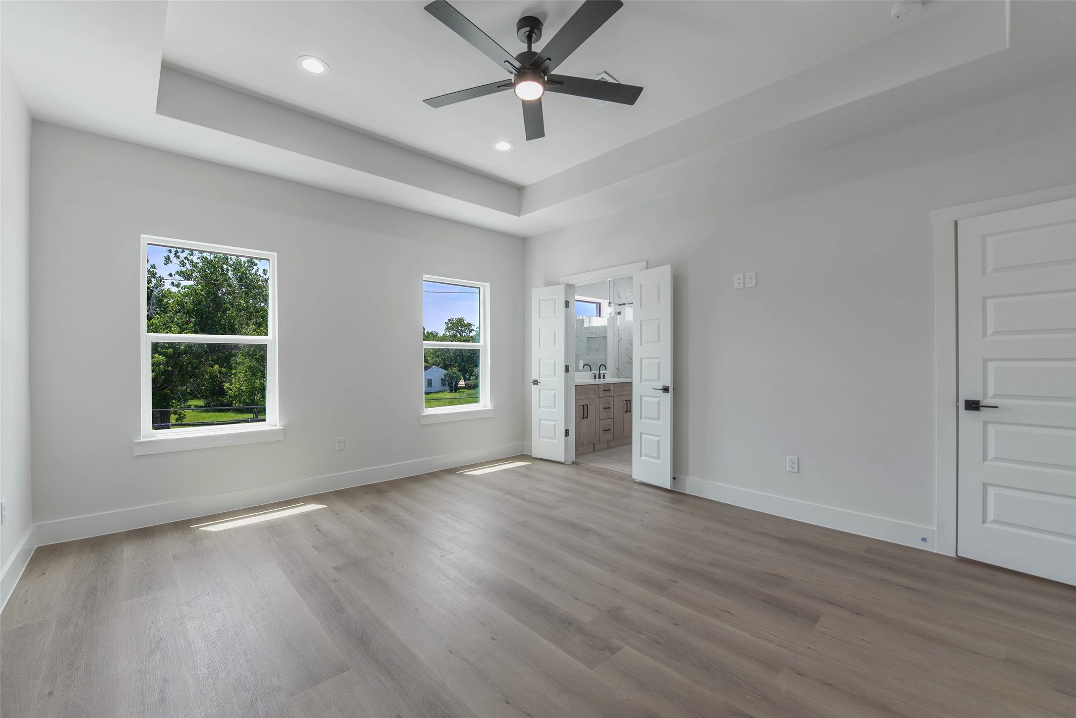 9311 Jutland Road Houston, TX 77033 - Photo 10 of 28 The upper level features a private primary bedroom with an ensuite bath and spacious walk-in closet.
