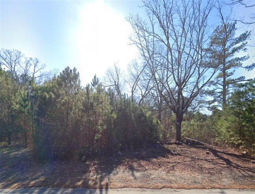 8470 Cedar Grove Road Fairburn, GA 30213 - Photo 1 of 1 a view of a yard with trees