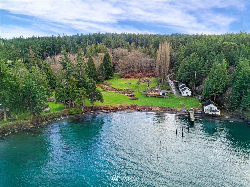 416 Lonesome Cove Road Friday Harbor, WA 98250 - Photo 2 of 40 a view of a lake with houses in the back
