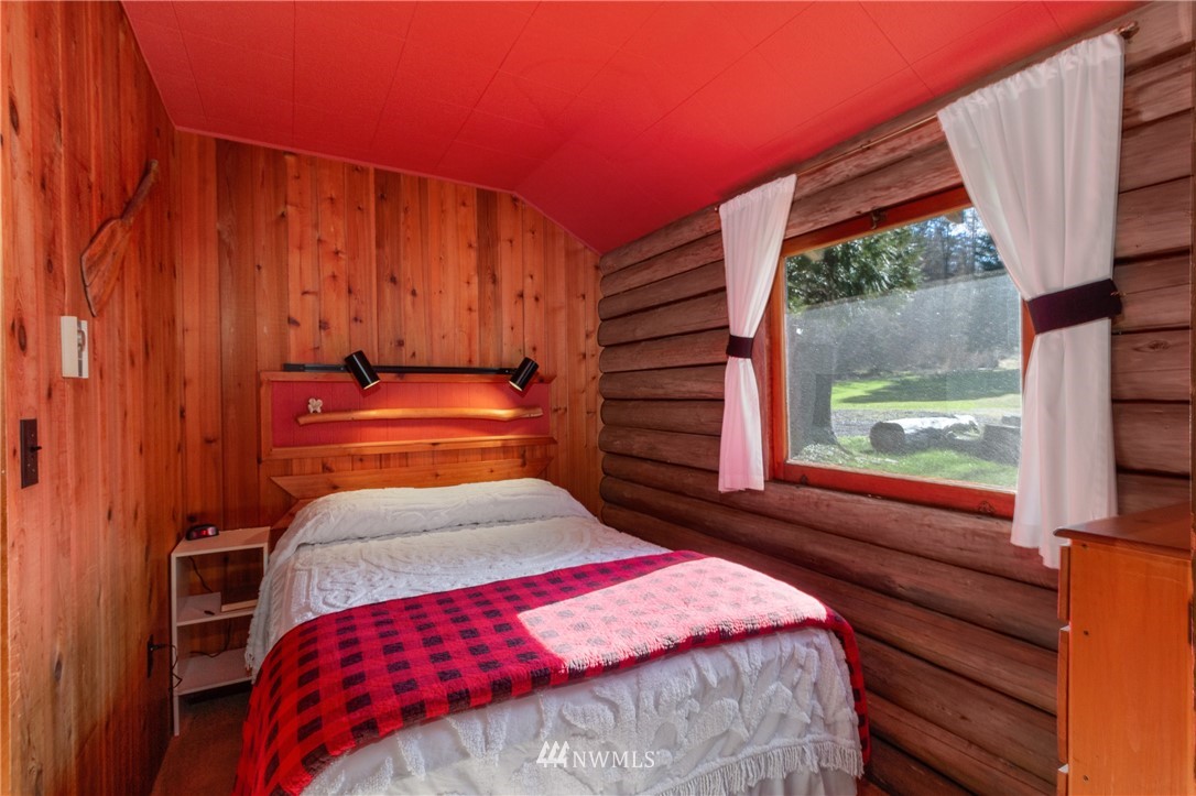 416 Lonesome Cove Road Friday Harbor, WA 98250 - Photo 38 of 40 a bedroom with a bed and a window