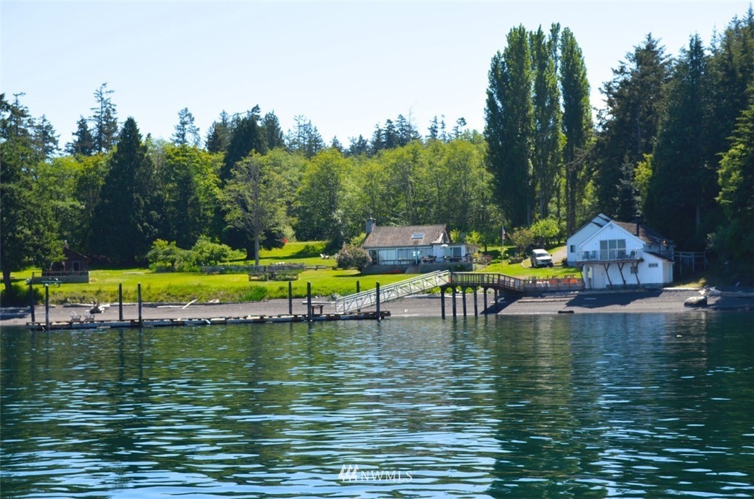 416 Lonesome Cove Road Friday Harbor, WA 98250 - Photo 5 of 40 a view of an ocean with boats and trees in the background