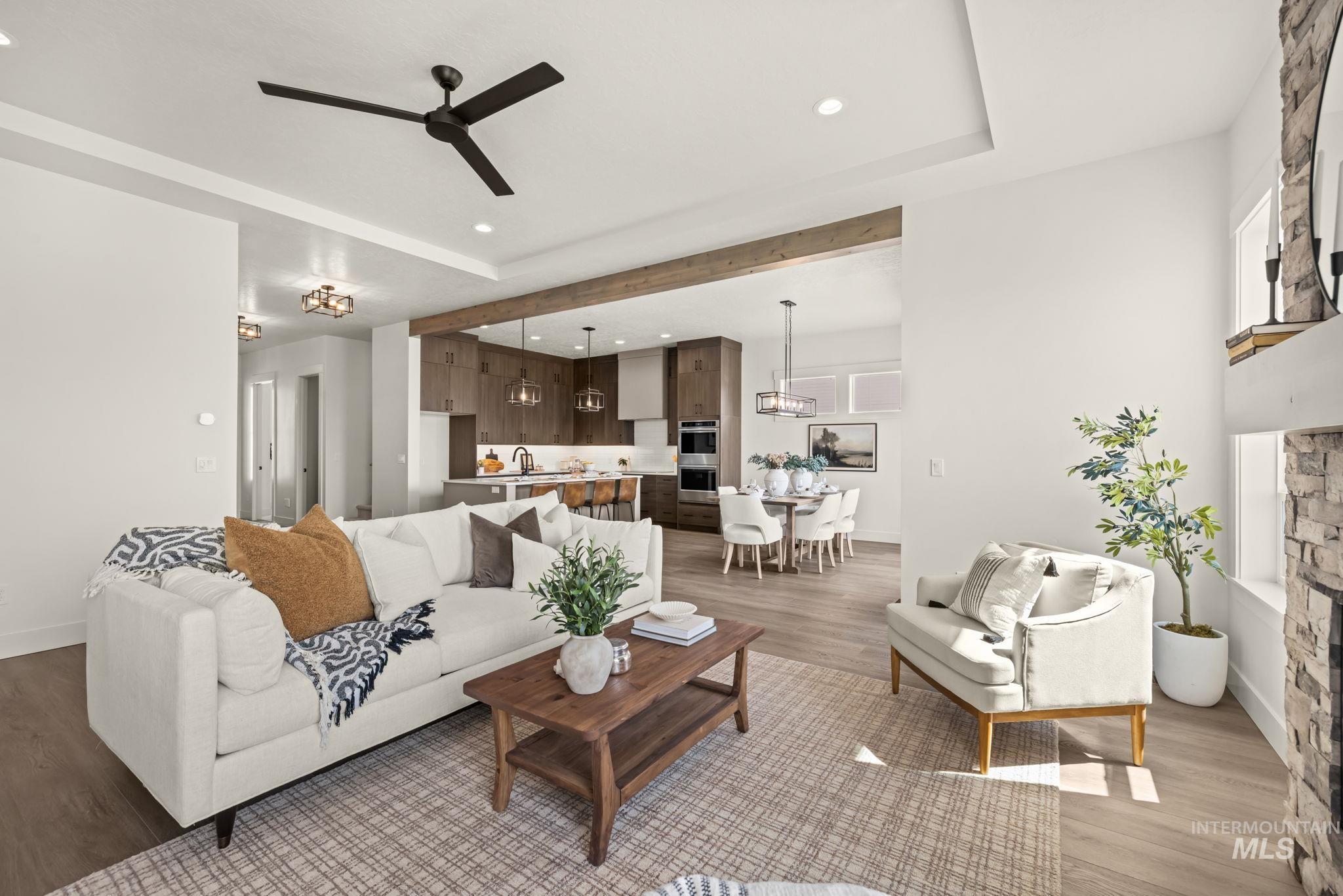 345 South Strut Way Boise, ID 83716 - Photo 22 of 50 Open-concept living area with wood-finish flooring, a recessed ceiling, and a ceiling fan