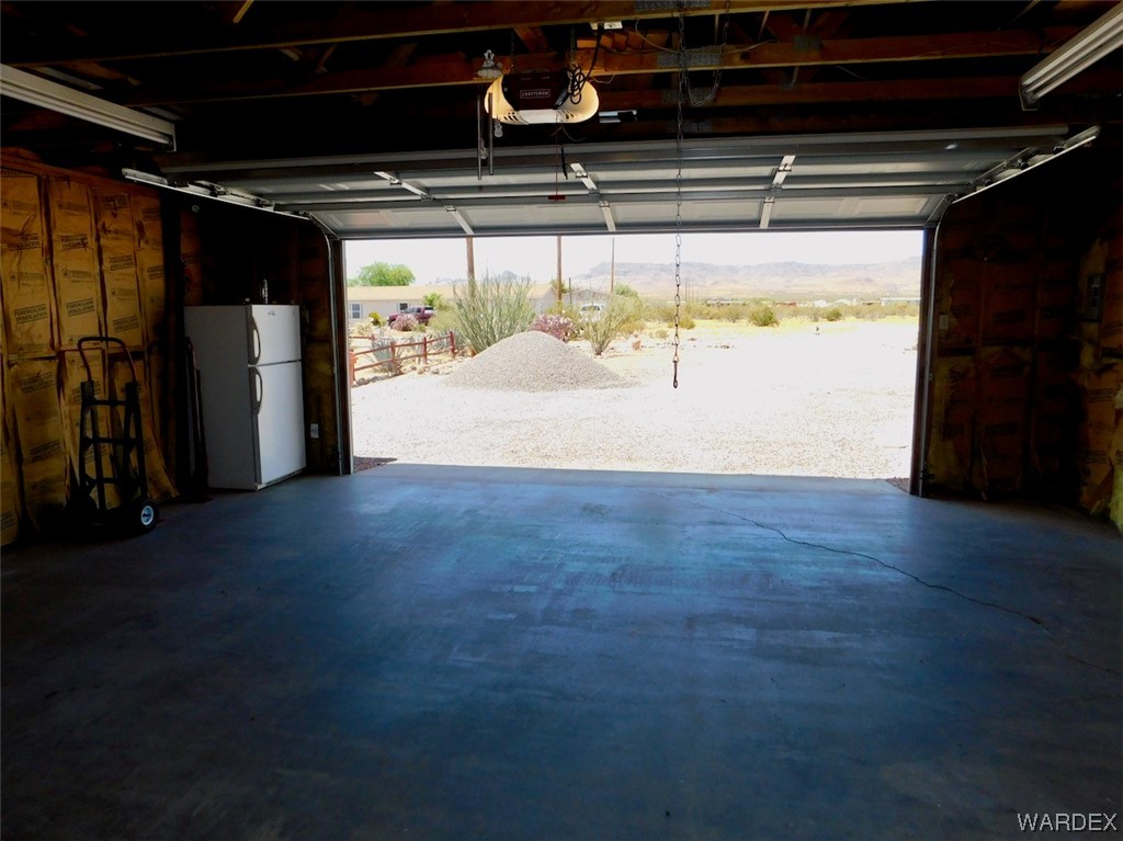 4182 Dragoon Road Golden Valley, AZ 86413 - Photo 54 of 65 a view of water heater room with wooden floor