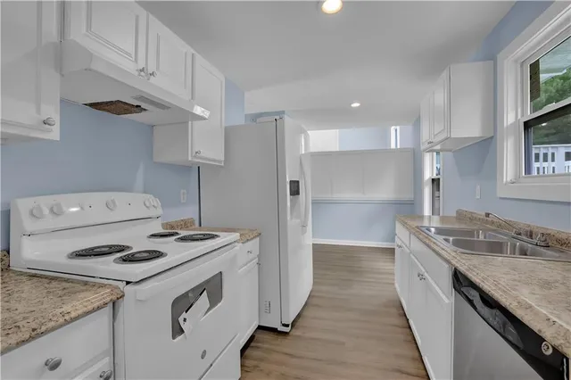 a kitchen with a stove and a sink
