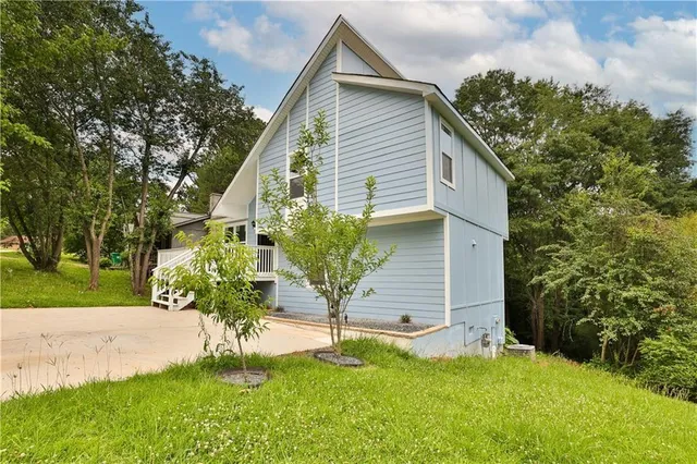 a front view of a house with a yard