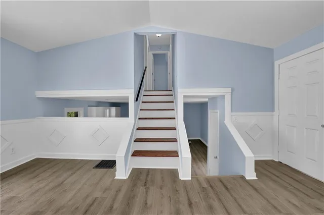 a view of entryway with wooden floor