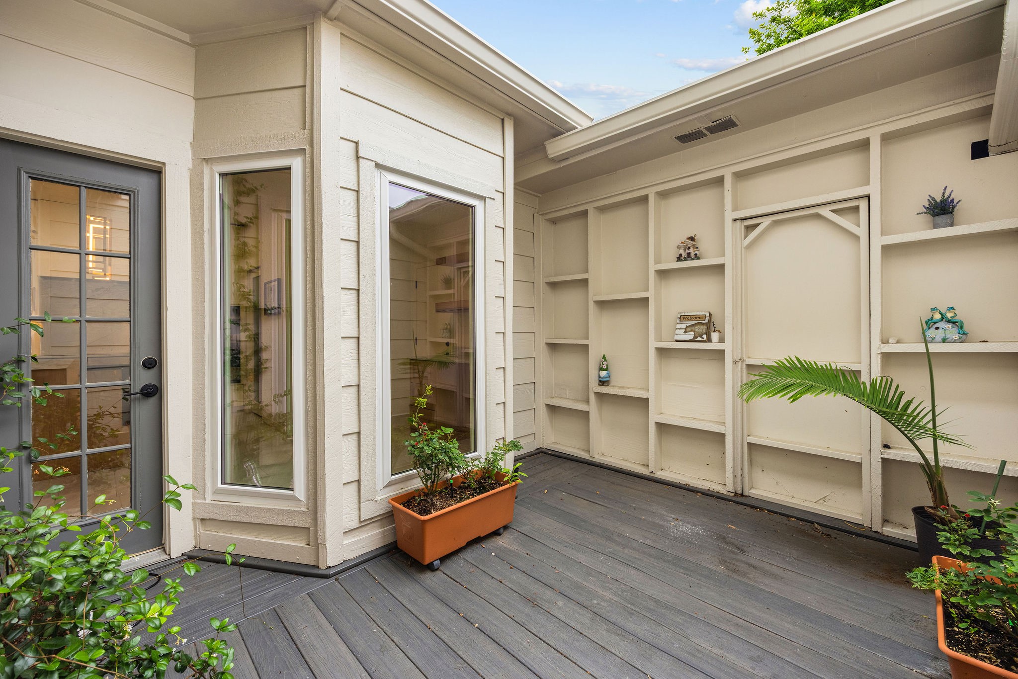 727 Bunker Hill Road, Unit 26 Houston, TX 77024 - Photo 12 of 25 The outdoor patio has been turned into a plant paradise with room for outdoor furniture. The owners water the plants on a timed sprinkler system, making it completely hassle-free.