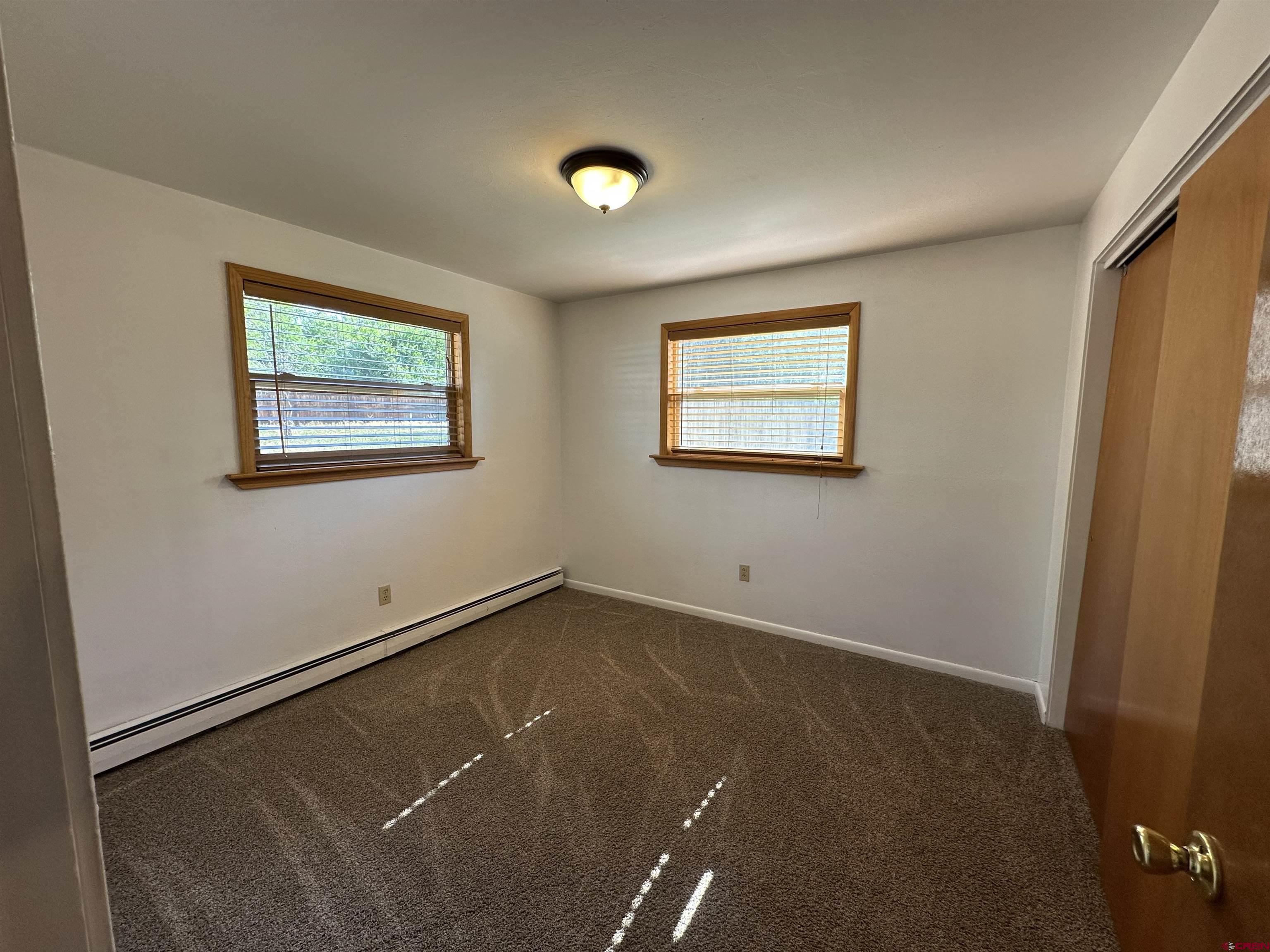490 West Main Street Cedaredge, CO 81413 - Photo 19 of 31 an empty room with a window