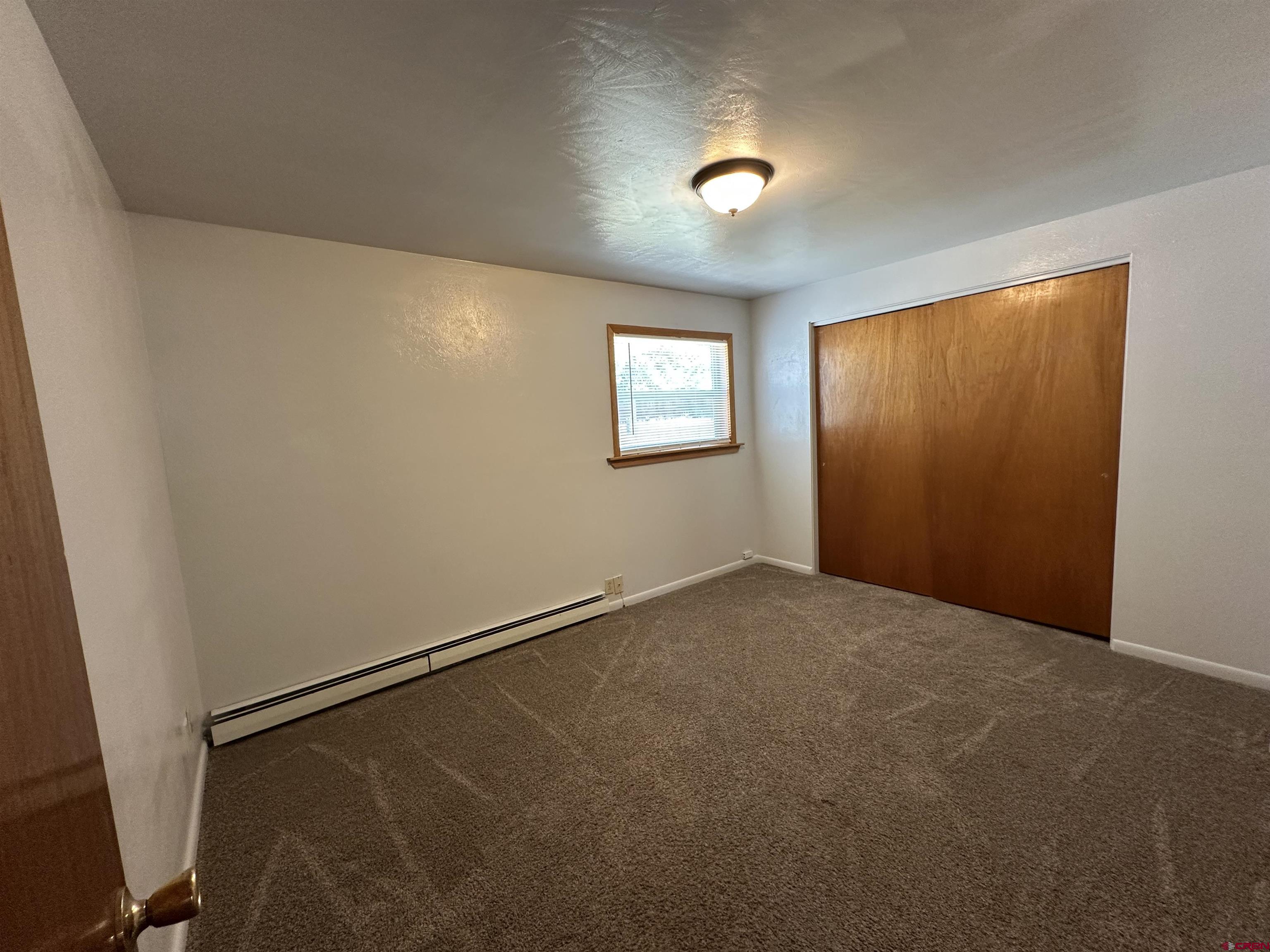 490 West Main Street Cedaredge, CO 81413 - Photo 20 of 31 an empty room with windows