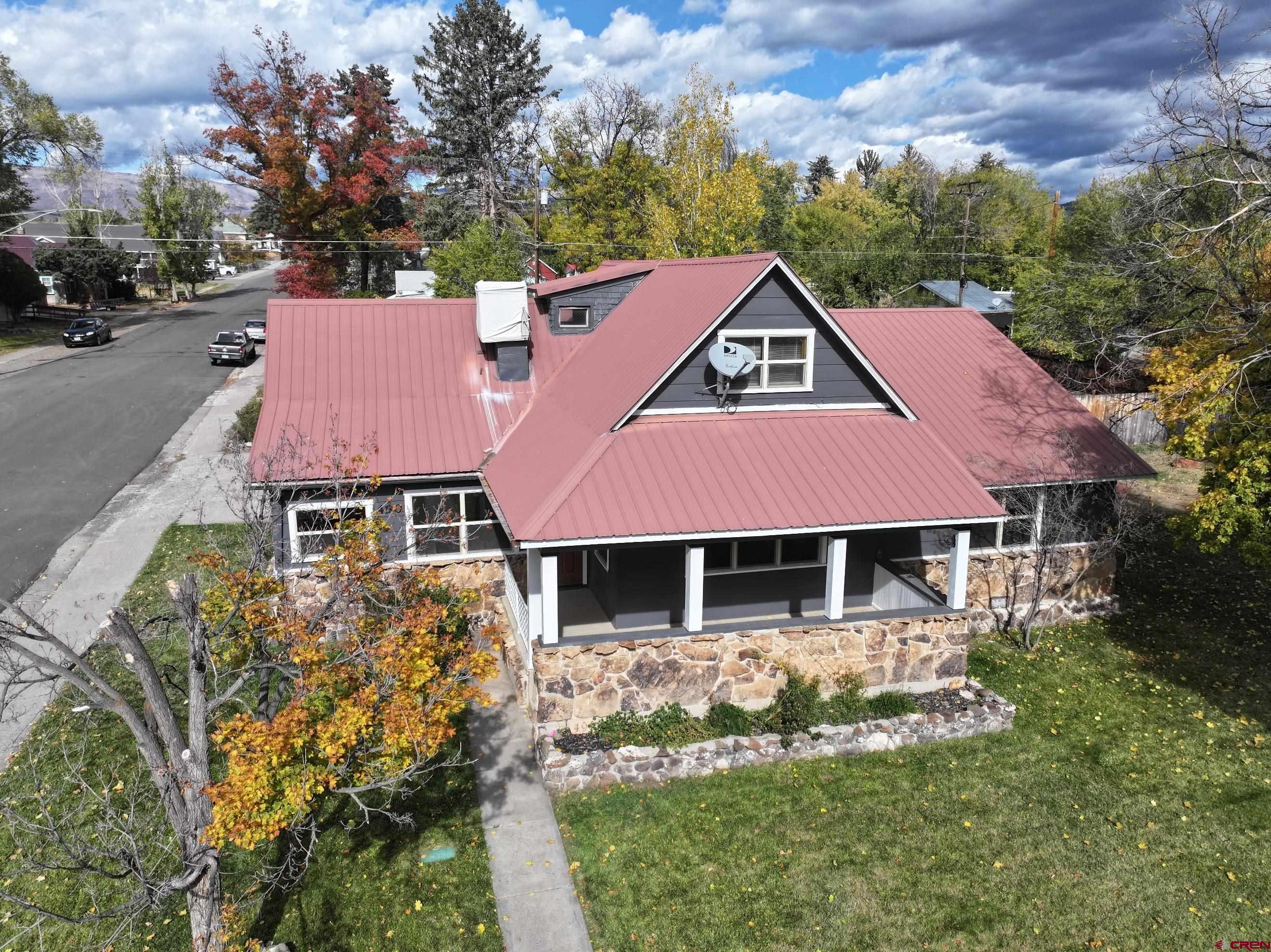 490 West Main Street Cedaredge, CO 81413 - Photo 2 of 31 a front view of a house with a garden