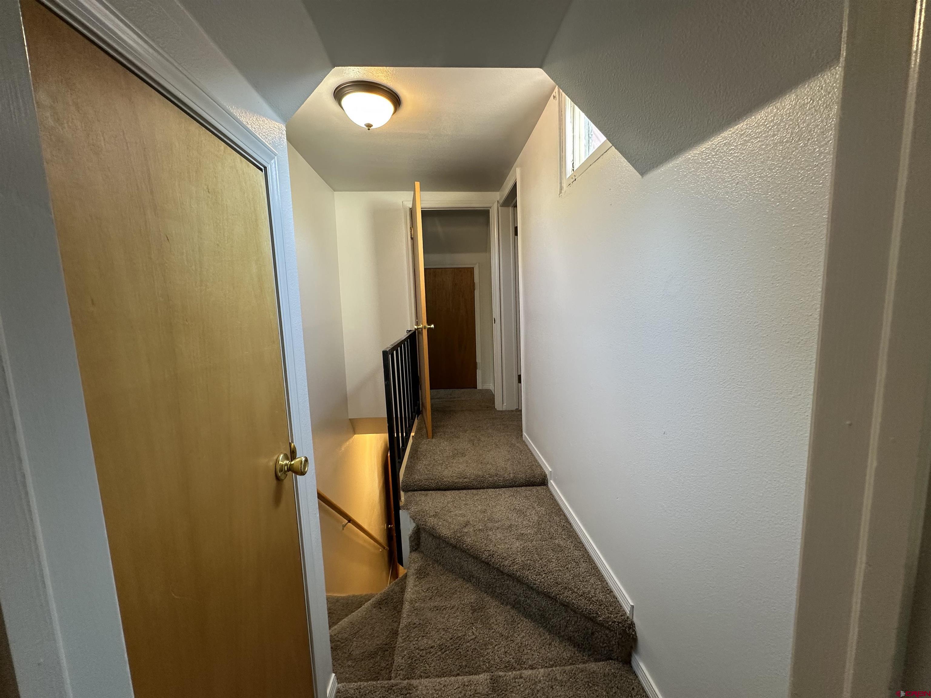 490 West Main Street Cedaredge, CO 81413 - Photo 25 of 31 a hallway with sliding door
