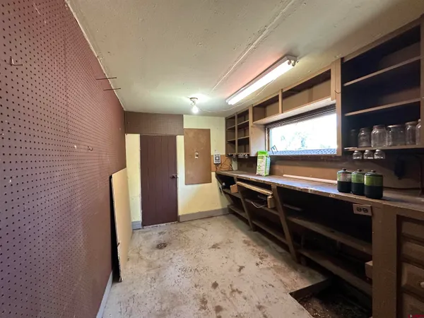 a kitchen with stainless steel appliances a refrigerator and wooden cabinets