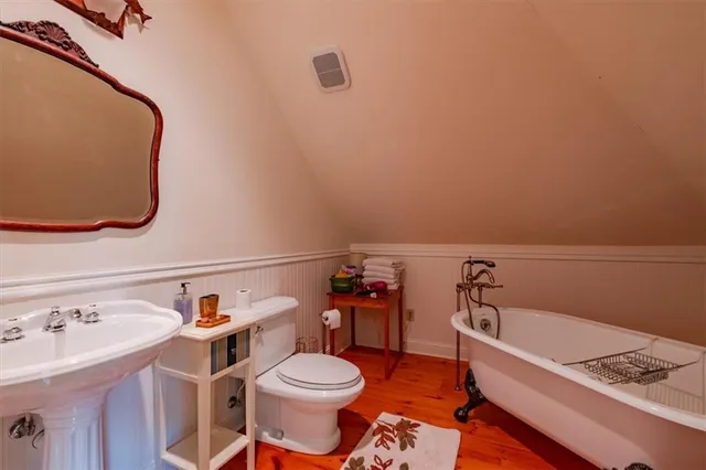 a view of a livingroom with furniture and staircase