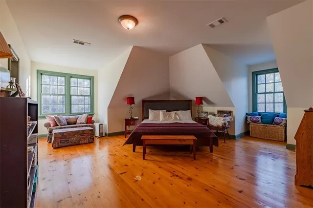 a view of a livingroom with furniture and a book shelf